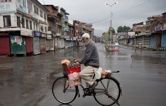 old-man-on-cycle-in-kashmir
