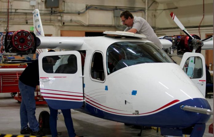 Technicians work on NASA's first all-electric plane, the X-57 Maxwell, at NASA's Armstrong Flight Research Center at Edwards Air Force Base, California