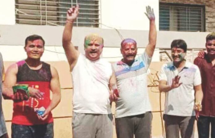 Justice Sudhir Bhajipale celebrates Holi with suspended Beed Police Sub-Inspector Rajesh Patil and Prashant Mahajan