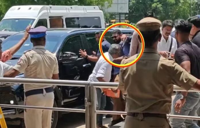 madurai-airport-actor-politician-tvk-vijay-security-gun-at-fan madurai-airport-actor-politician-tvk-vijay-security-gun-at-fan